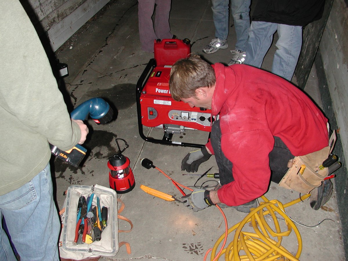 NATE-certified HVAC technician working on a furnace in Longmont home
